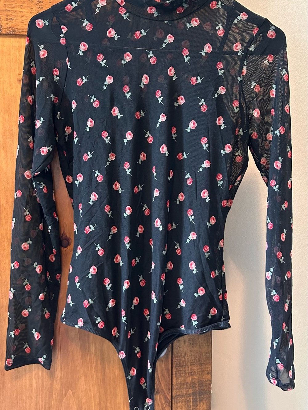Hollister Black Mesh Floral Body Suit  with Red Rose Print Size Medium.